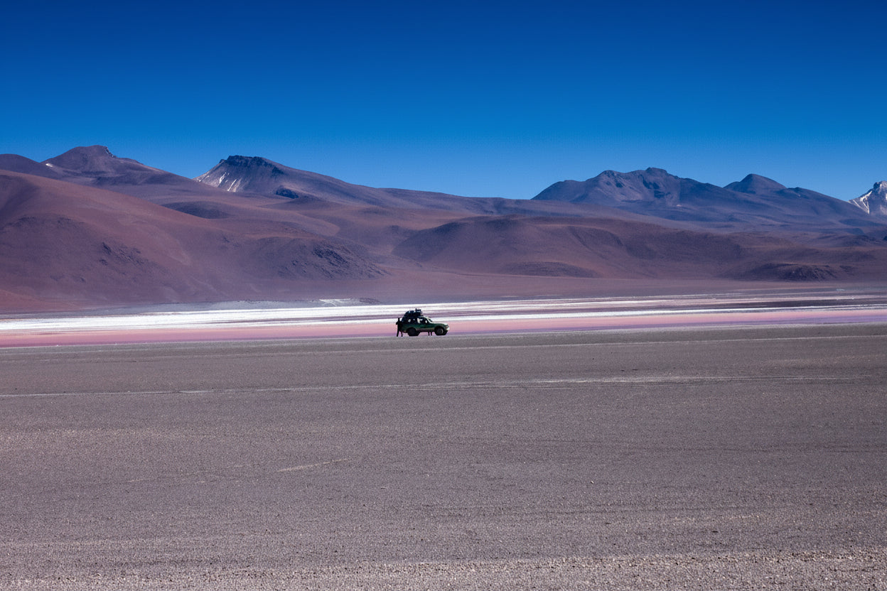 Private 4x4 crossing the high desert plains of Siloli in South Lipez, Bolivia