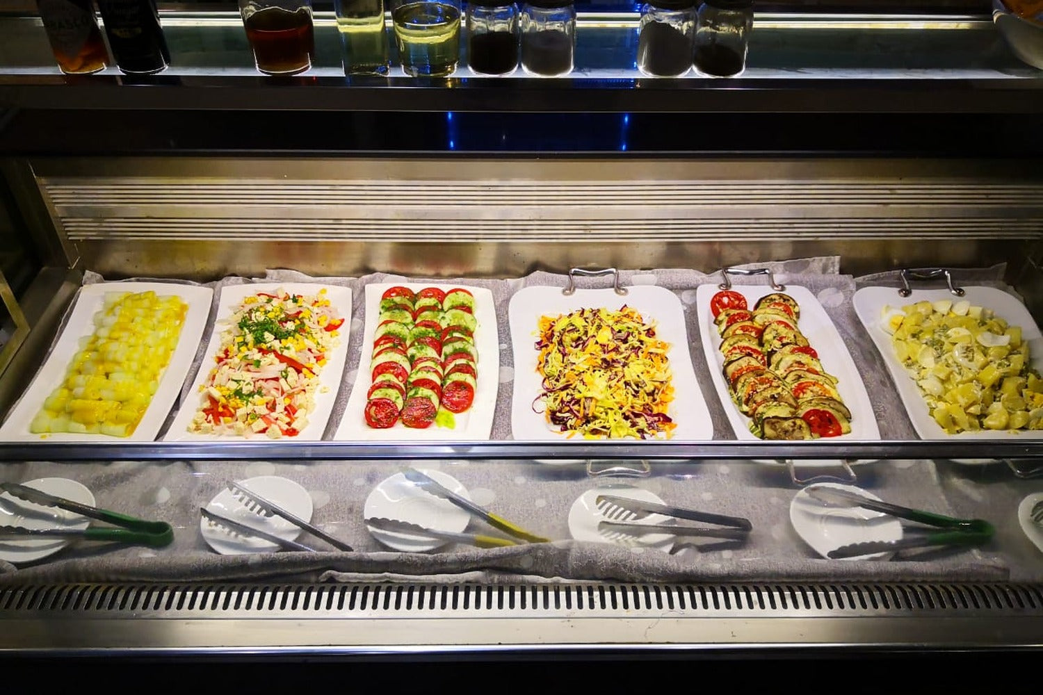 A buffet with a variety of dishes arranged on a counter at a hotel in the Uyuni Salt Flat.