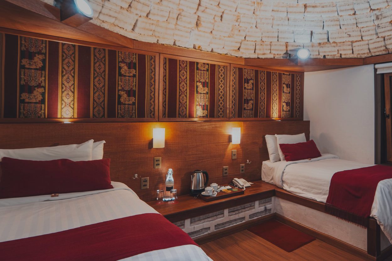 Hotel room with two beds, nightstands, and decorations in the Uyuni Salt Flats.
