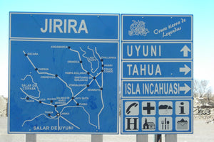 Blue road sign with map and directional information for Jirira, Uyuni, Tahua and Incahuasi Island.