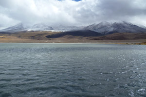 Lake with snow-capped mountains in the background at South Lipez