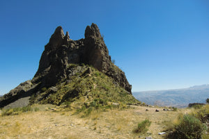 Rocky outcrop with a clear blue sky in the background