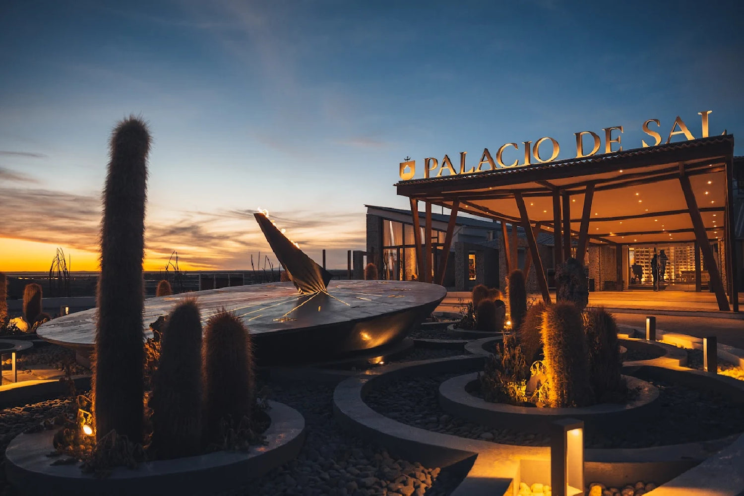Facade of the exclusive Palacio de Sal at sunset, an iconic luxury hotel built in harmony with the Uyuni Salt Flats landscape