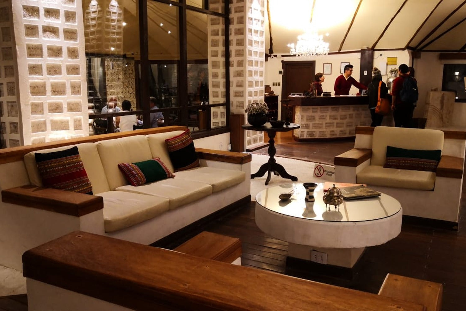 Modern living room with a sofa, coffee table, and decorative pillows.
