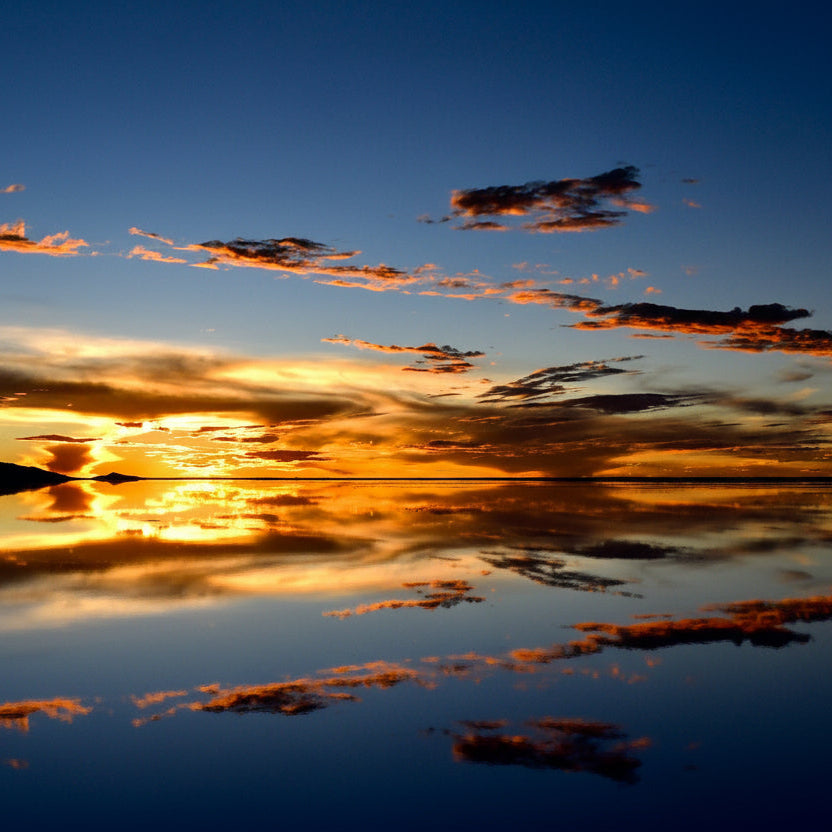 Golden sunset over the Uyuni Salt Flats during mirror season.